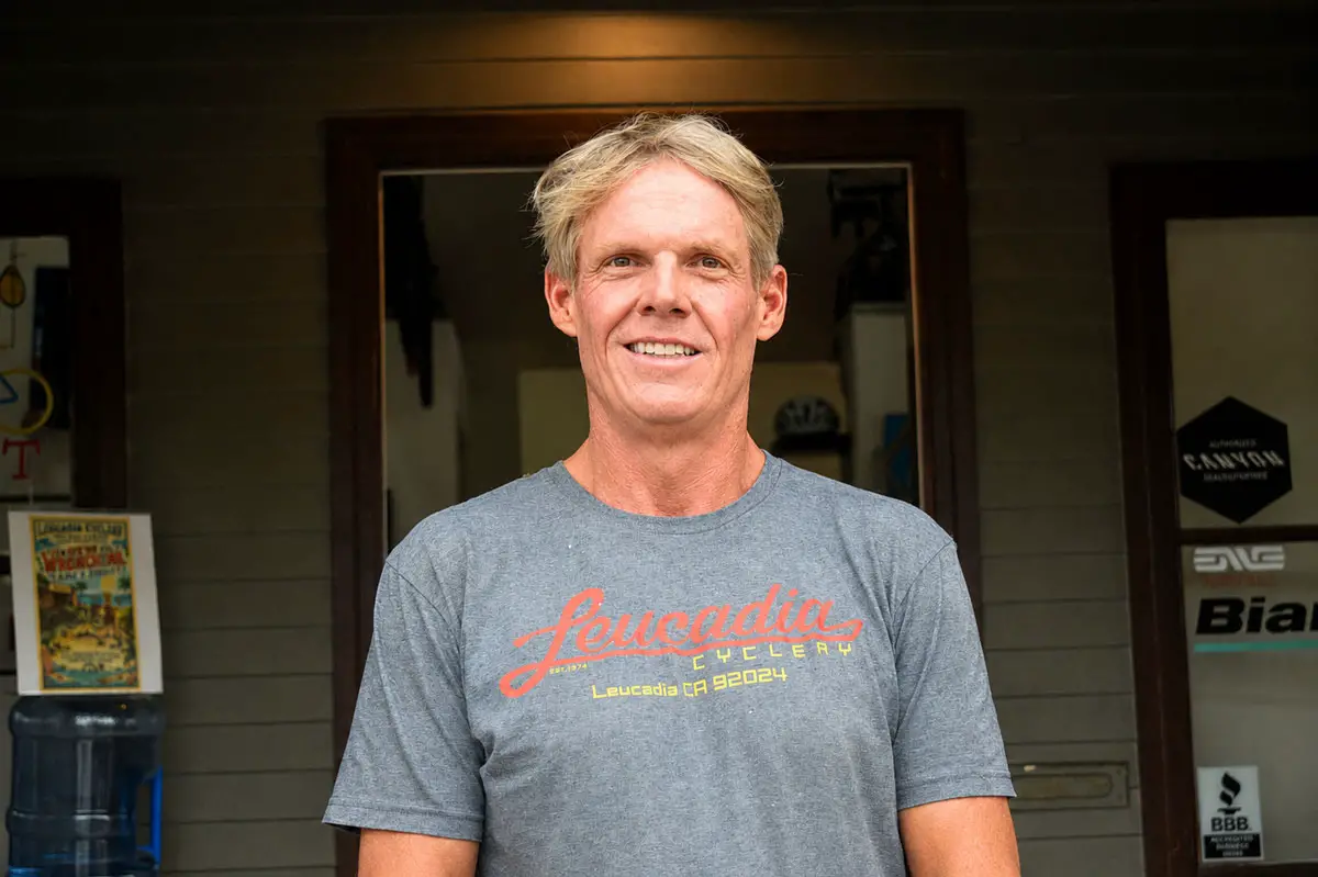 Leucadia Cyclery owner Jeff Schade stands outside his shop along North Coast Highway 101 in Leucadia, where ongoing construction from the Leucadia Streetscape project has affected customer access and business operations. Photo by Summer Hu