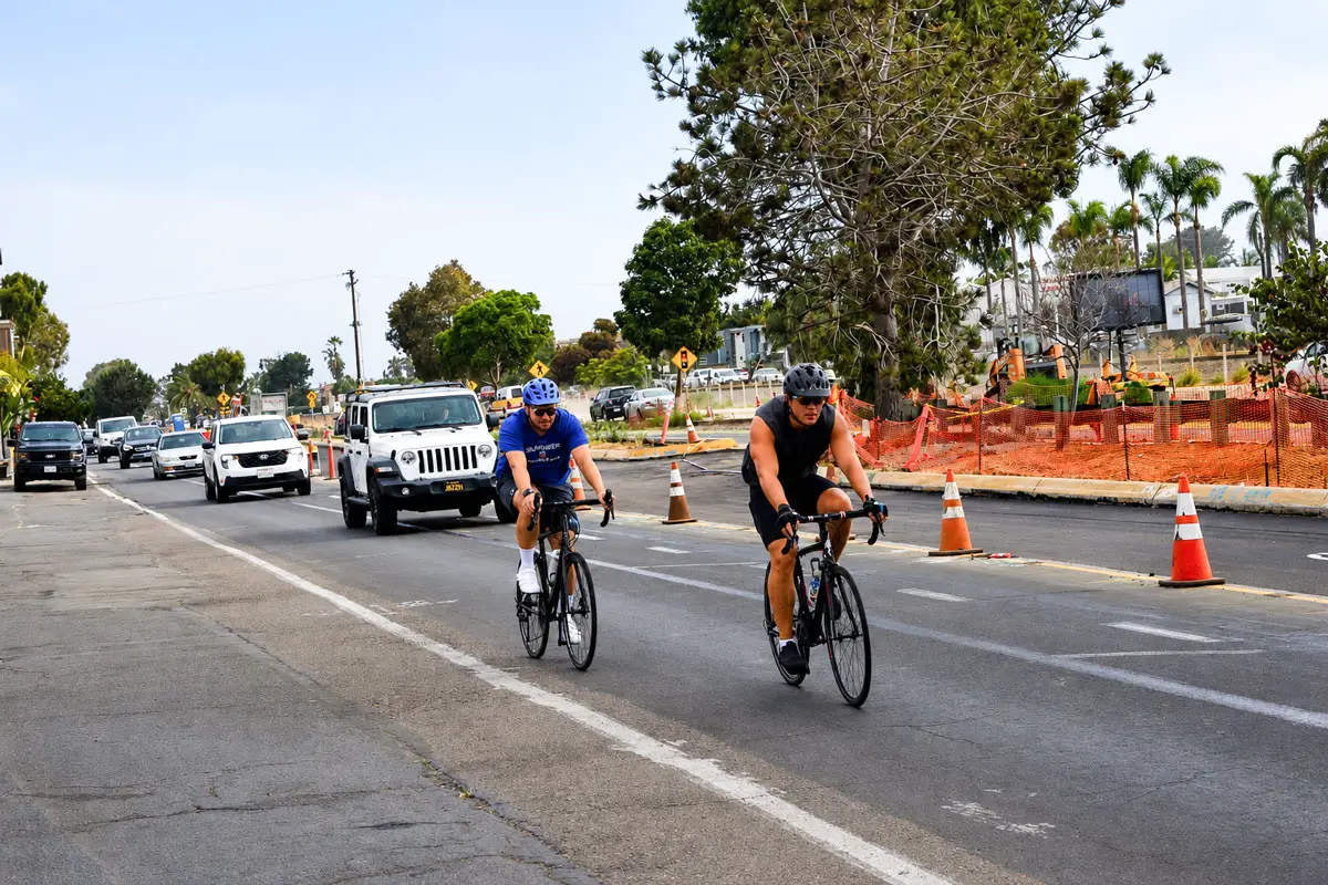 Pedestrians, cyclists and motorists share North Coast Highway 101 in Leucadia while construction continues on the Leucadia Streetscape project, which is intended to improve safety and mobility along the corridor. Photo by Summer Hu