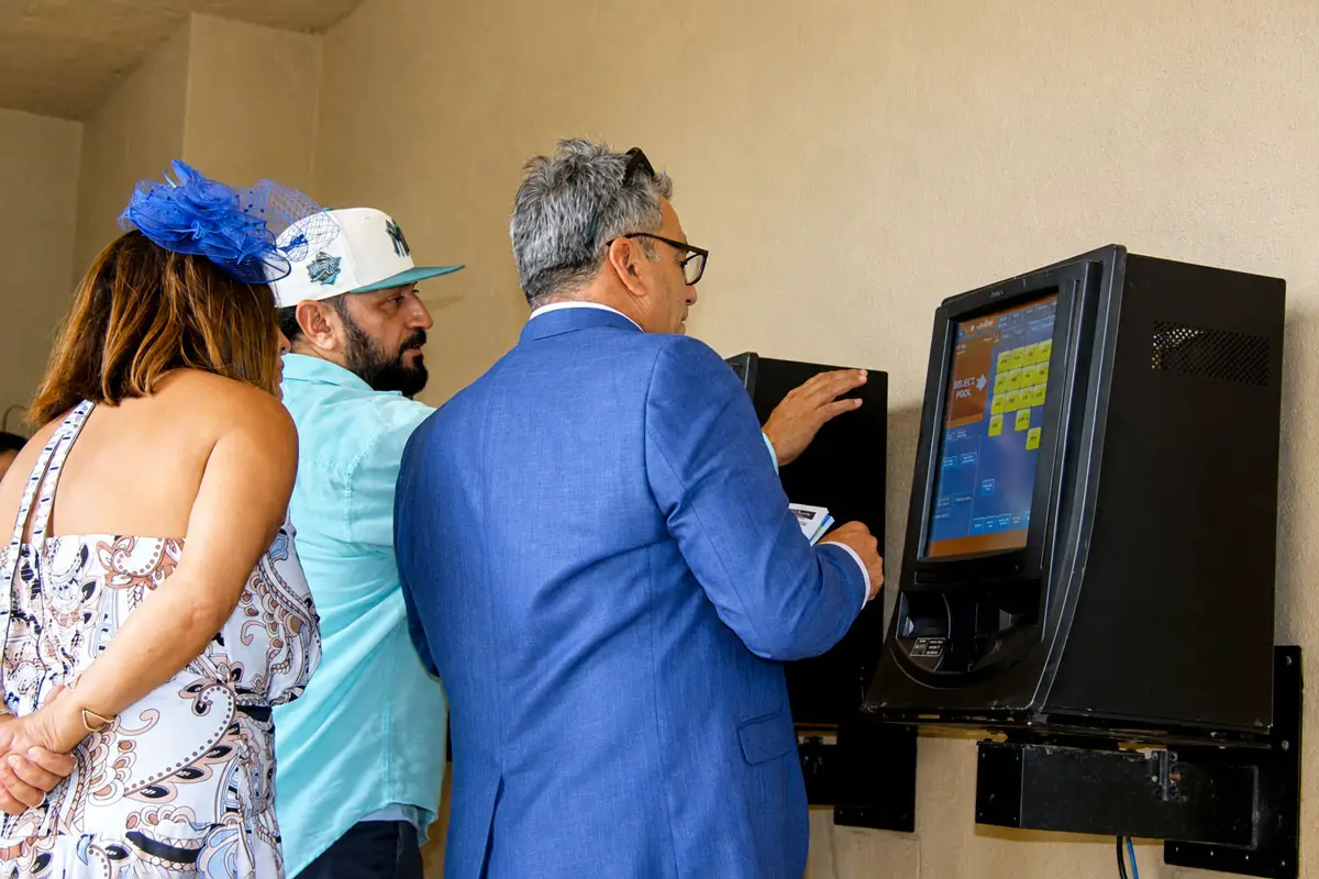 Opening Day attendees cast bets ahead of the first post on July 17 at the Del Mar racetrack. Photo by Leo Place