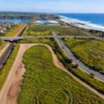 An aerial view shows Planning Area F between Coast Highway and Interstate 5 in Carlsbad, where state regulators are expected to consider amendments tied to a proposed mixed-use development.