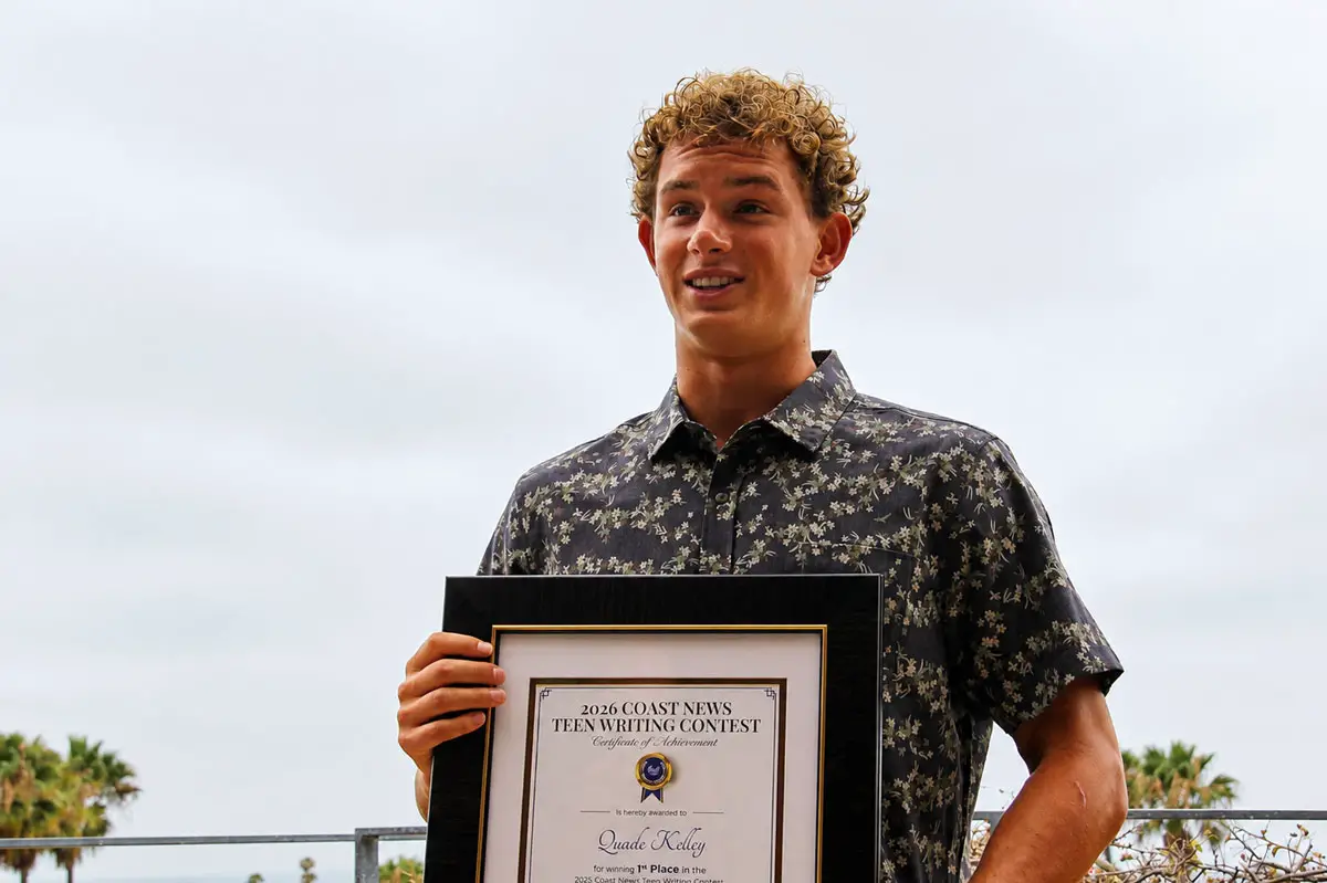 Quade Kelley, first-place winner of The Coast News Teen Writing Contest, speaks during a July 9 awards ceremony at the Encinitas Library. Photo by Jordan P. Ingram
