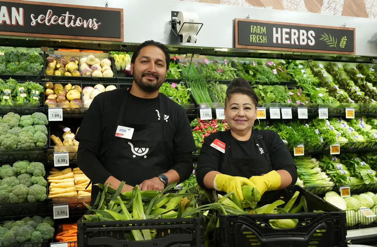 Employees smile in the remodeled produce department at the new Ralphs grocery store in La Costa. Photo by Cameron Adams