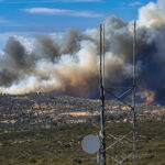 Smoke billows from the Creelman Fire near Ramona on July 22 as the fast-moving wildfire burns through brush and threatens nearby homes. Courtesy photo/UC San Diego AlertCalifornia