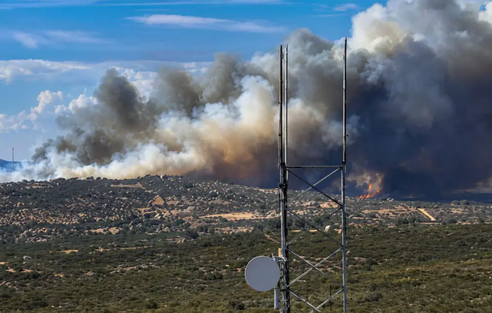 Smoke billows from the Creelman Fire near Ramona on July 22 as the fast-moving wildfire burns through brush and threatens nearby homes. Courtesy photo/UC San Diego AlertCalifornia