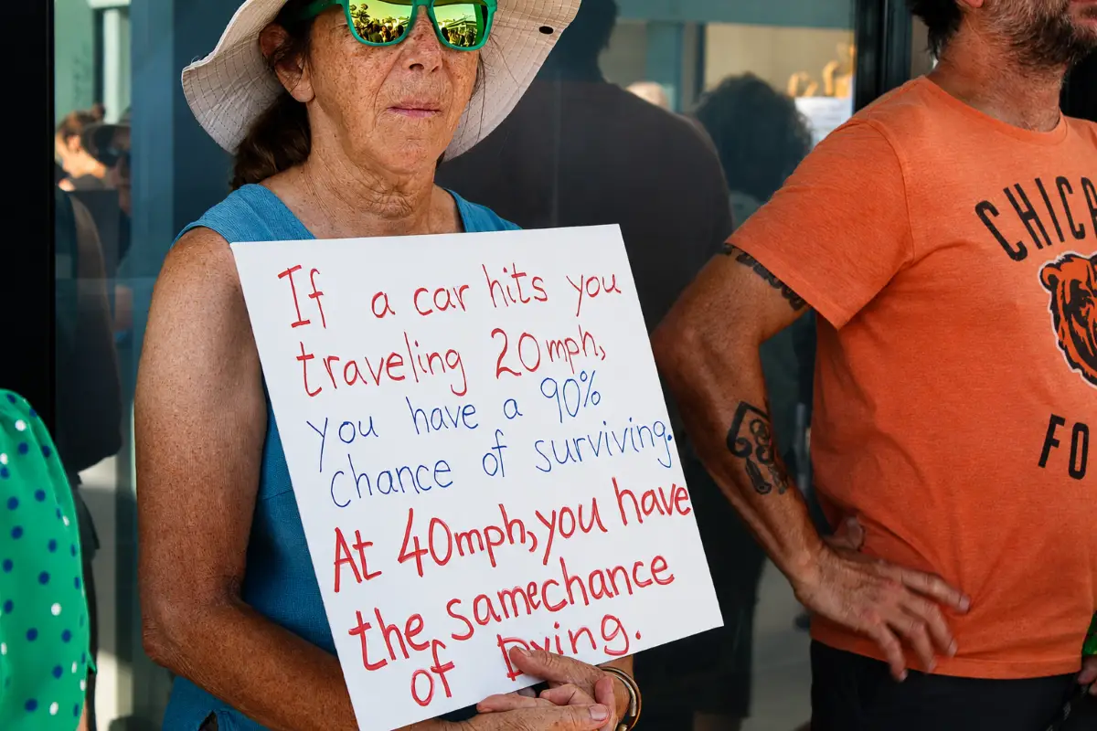 Community members rally outside Encinitas City Hall on July 21, calling on city officials to take stronger action to improve traffic and pedestrian safety. Photo by Samantha Nelson