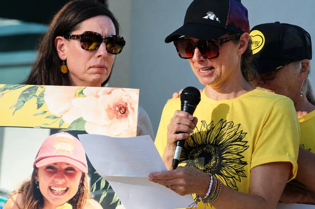 Bridget Chalekian speaks through tears during a July 21 rally outside Encinitas City Hall. Photo by Samantha Nelson