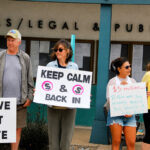 Demonstrators gather outside Encinitas City Hall on June 24 to protest the proposed overhaul of improvements along Santa Fe Drive. Photo by Summer Hu
