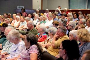 People sitting in a large room
