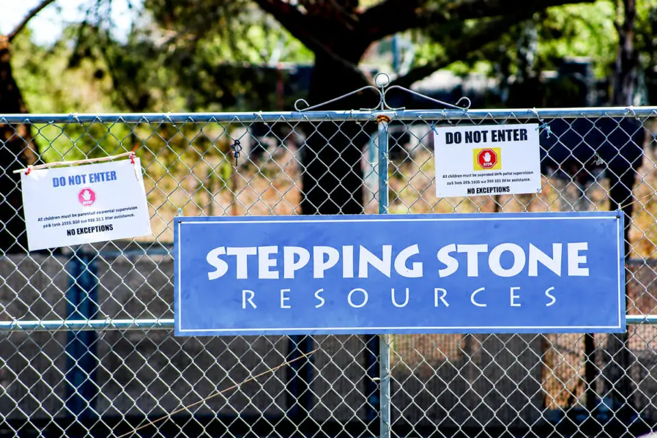 A sign posted on a chain link fence at Stepping Stone Resources care facility in Fallbrook.