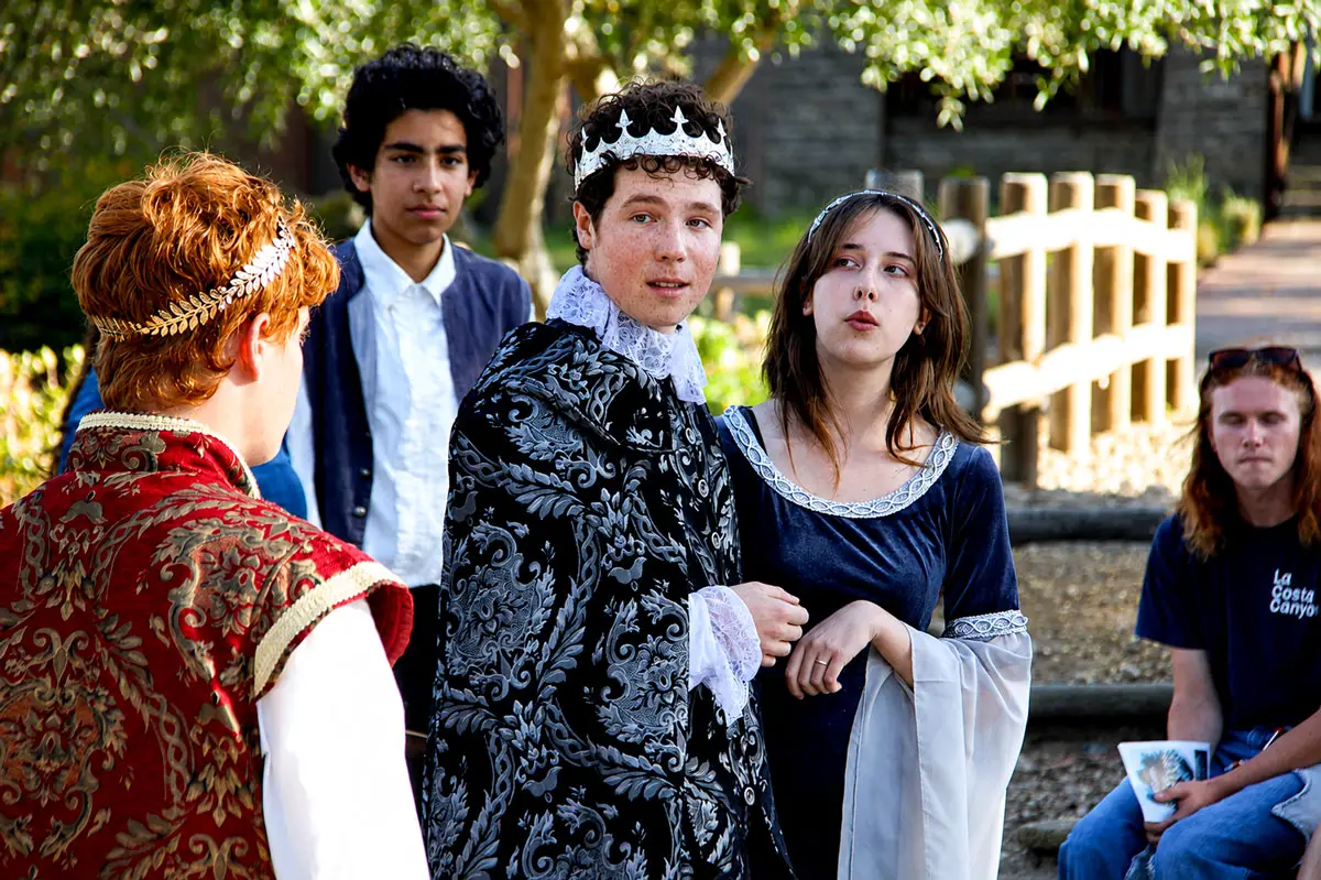 Kai Bunyak, portraying King Leontes, center, and Isabella Podesta, right, perform on July 16 in “The Winter’s Tale” at the Olivenhain Town Meeting Hall. Photo by Leo Place