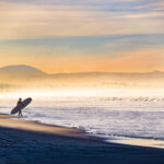 For many surfers, time in the ocean inspires more than a love of waves. Photo by Gloria Moeller