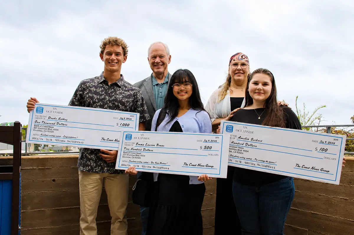 This year's winners of The Coast News Teen Writing Contest, Quade Kelley, left, Amelia Seibert, right, and Emma Lauren Benas, center, with Encinitas Mayor Bruce Ehlers and contest sponsor Melissa Huk of Ms. Oceanside Real Estate on July 9 in Encinitas. Photo by Jordan P. Ingram