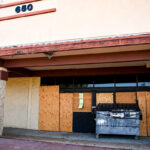 The former Burlington Coat Factory building at 650 Sycamore Avenue in Vista has sat vacant for six years and fallen into disrepair. The Vista City Council will hold a public hearing Aug. 11 to consider declaring the property a public nuisance. Photo by Leo Place