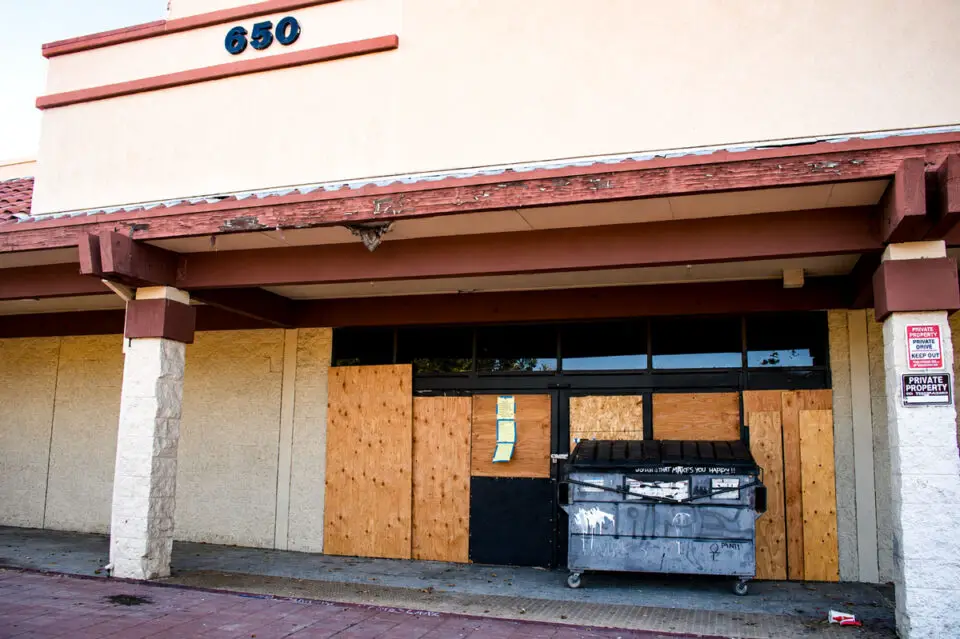 The former Burlington Coat Factory building at 650 Sycamore Avenue in Vista has sat vacant for six years and fallen into disrepair. The Vista City Council will hold a public hearing Aug. 11 to consider declaring the property a public nuisance. Photo by Leo Place