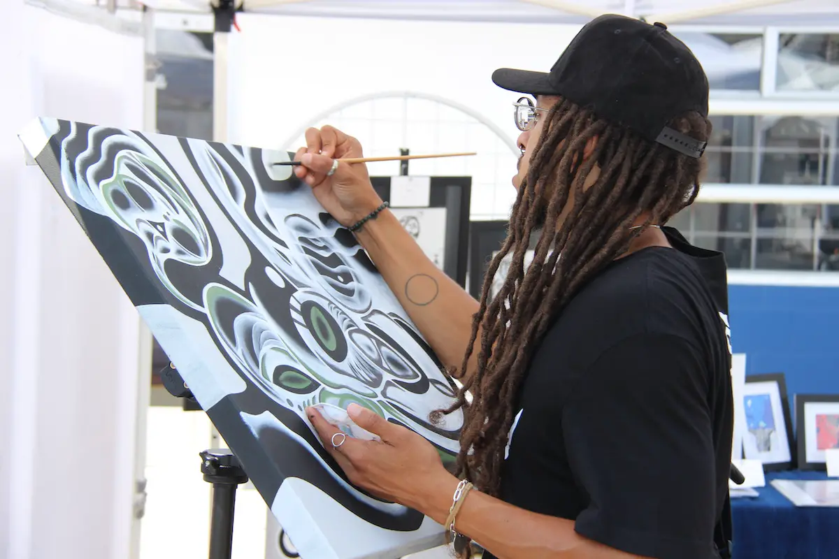 An artist at LeucadiART Walk. Photo by Cameron Adams