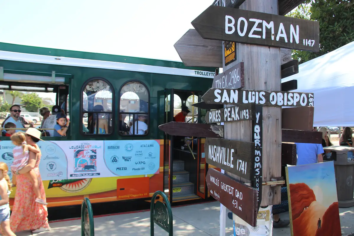 Open air trolley makes a stop at LeucadiART Walk. Photo by Cameron Adams