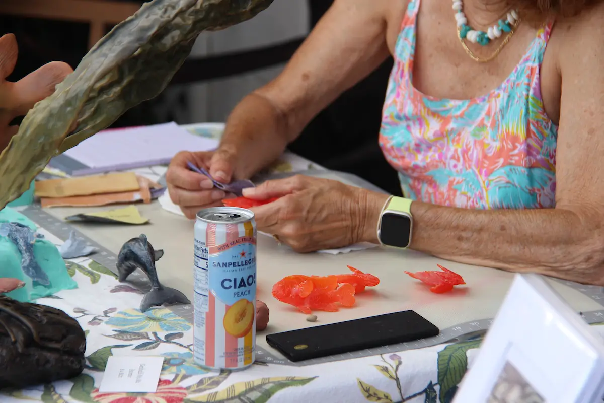 An artist works on a piece as part of LeucadiART Walk. Photo by Cameron Adams