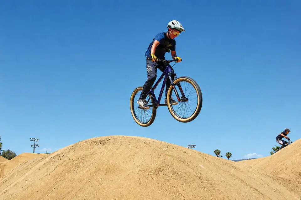 A young rider catches air off a dirt jump at Bradley Bike Park in San Marcos. File photo/Leo Place