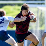 Torrey Pines High senior David “Duck” Choy carries the ball during a rugby match. Courtesy photo