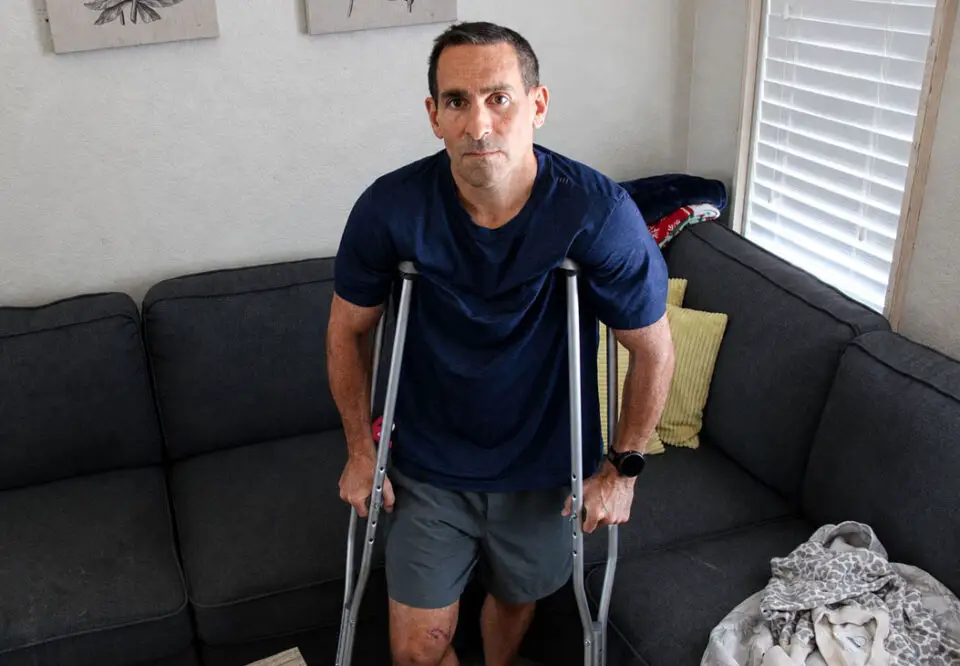 Encinitas attorney Mike Eisenberg uses crutches at his home after being struck and injured by a hit-and-run driver Aug. 16 on Glen Arbor Drive. Photo by Jordan P. Ingram