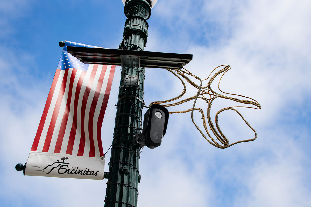 A Flock license plate reader camera affixed to a light pole along Encinitas Boulevard on Aug. 3 in Encinitas. Photo by Christian Howell 