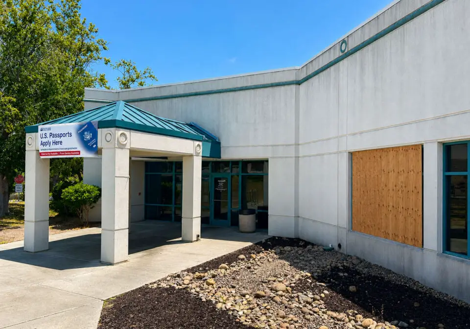 A boarded-up window is visible at the Encinitas post office on Garden View Road after a vehicle crashed into the building Aug. 1. The post office remains open. Photo by Cameron Adams