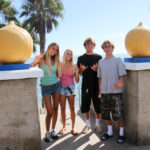 Encinitas surfers (L-R) Victoria Duprat, Maddie Stanton, Jett Maughan, and Dane Libby will compete in the International Surfing Association’s World Junior Surfing Championships. Photo by Cameron Adams