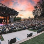 Moonlight Amphitheatre in Vista filled with an audience during a performance at sunset.