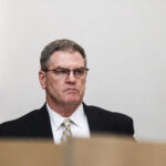 Deputy District Attorney John Philpott, left, presents the prosecution’s case against Jeffrey Roberson, who is accused of the 2008 killing of a paraplegic military veteran. Photo by Summer Hu