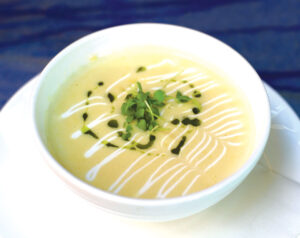 The summer corn soup is the perfect way to start your meal. Photo by Jess Valtierra