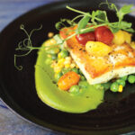 California Halibut at Lana paired with a bright, velvety zucchini basil puree. Photo by Jess Valtierra