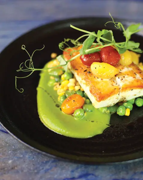 California Halibut at Lana paired with a bright, velvety zucchini basil puree. Photo by Jess Valtierra