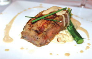 Prime New York steak with wild mushroom risotto joined 2019 Inglenook Cabernet Sauvignon for the third course. Photo by Rico Cassoni