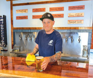 Beertender Tim Einzig brings service with a smile and is ready to answer any beer questions. Photo by Jeff Spanier