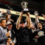 Arizona Rattlers head coach Kevin Guy hoists the Western Conference Championship trophy alongside his team after a 43-37 victory over the San Diego Strike Force on Sunday at Frontwave Arena in Oceanside. Courtesy photo/Rattlers