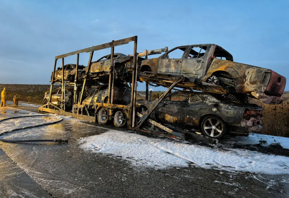 A burned-out car carrier sits along southbound Interstate 5 near the Aliso Creek Rest Area after catching fire early Thursday, destroying all six vehicles it was hauling. Courtesy photo/CHP