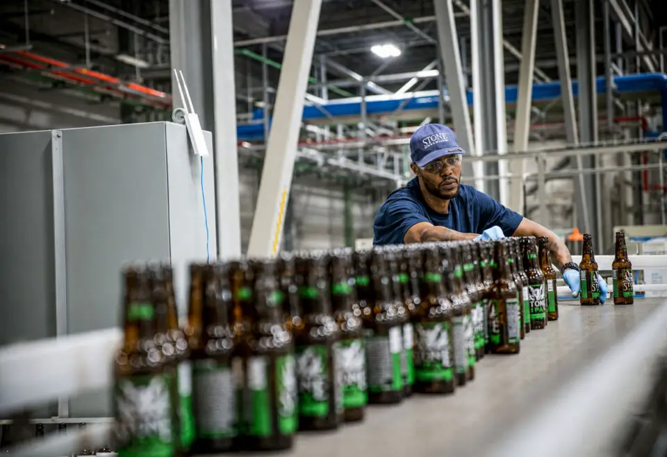 A Stone Brewing employee works along the bottling line at the company’s production facility. Courtesy photo/Stone