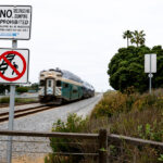 A train passes through the Chesterfield Drive crossing in Encinitas. The city is set to receive up to $33.6 million in federal funding for railroad crossing safety improvements along a six-mile stretch of the LOSSAN Rail Corridor. File photo/Michelle Slentz