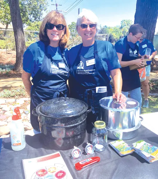 UC Master Food Preservers Ann Perreisa and Megan Murfen demonstrated food preservation techniques at Cole Library in Carlsbad on Aug. 8. Photo by Jano Nightingale