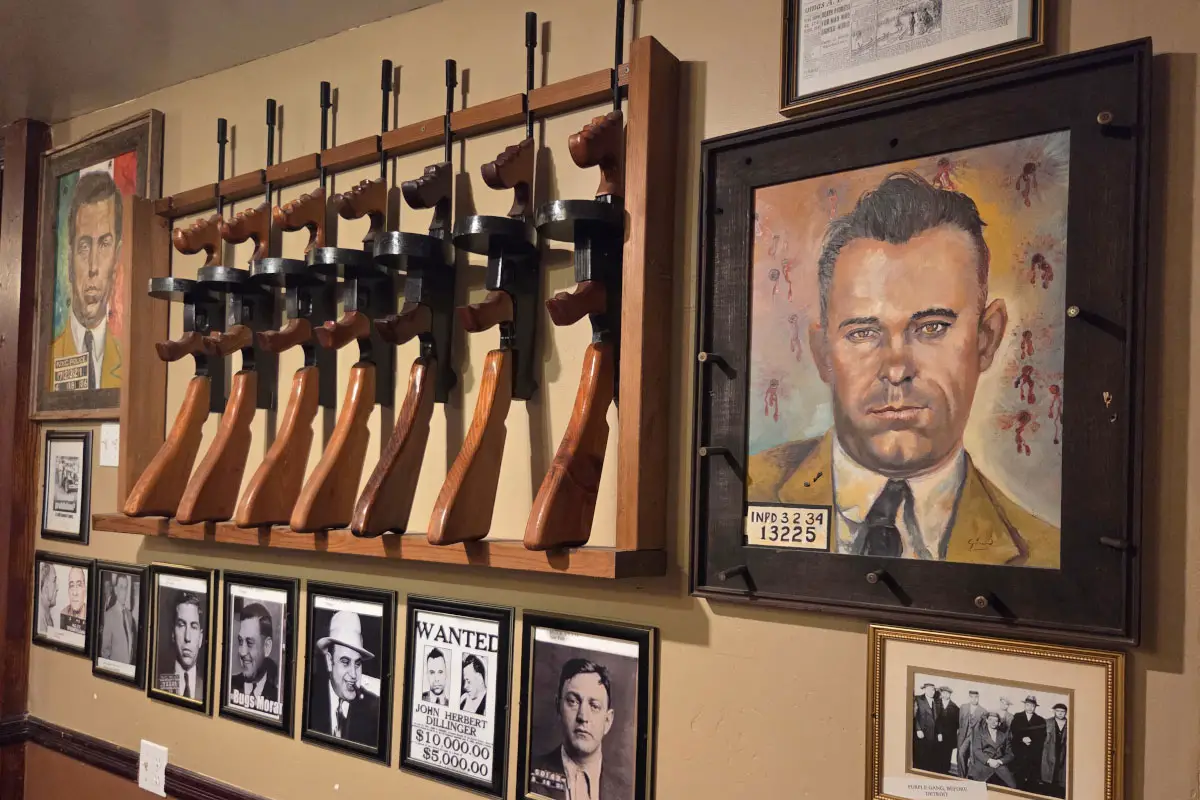 A row of fake Tommy guns lines the north wall of the main dining room at Prohibition Brewing Col. Photo by Jim Trageser