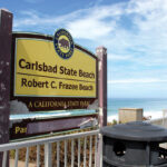 A deteriorating State Parks sign marks the entrance to Robert C. Frazee State Beach along Carlsbad Boulevard. Photo by Jordan P. Ingram