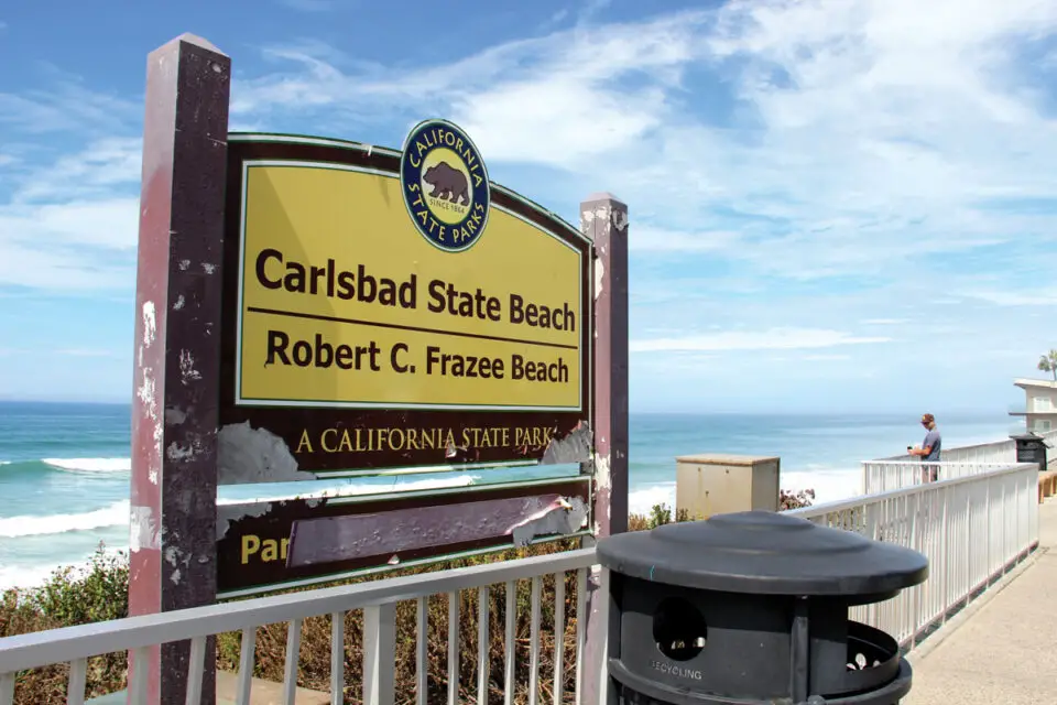 A deteriorating State Parks sign marks the entrance to Robert C. Frazee State Beach along Carlsbad Boulevard. Photo by Jordan P. Ingram