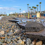 The Reef parking lot at Cardiff State Beach has crumbled after days of heavy rains and high surf. Photo by Jordan P. Ingram