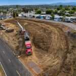 Construction crews and equipment work on the graded site of the future 24-unit Caritas Village – Vista affordable housing development off Plymouth Drive in Vista. Courtesy photo/Level 3 Construction