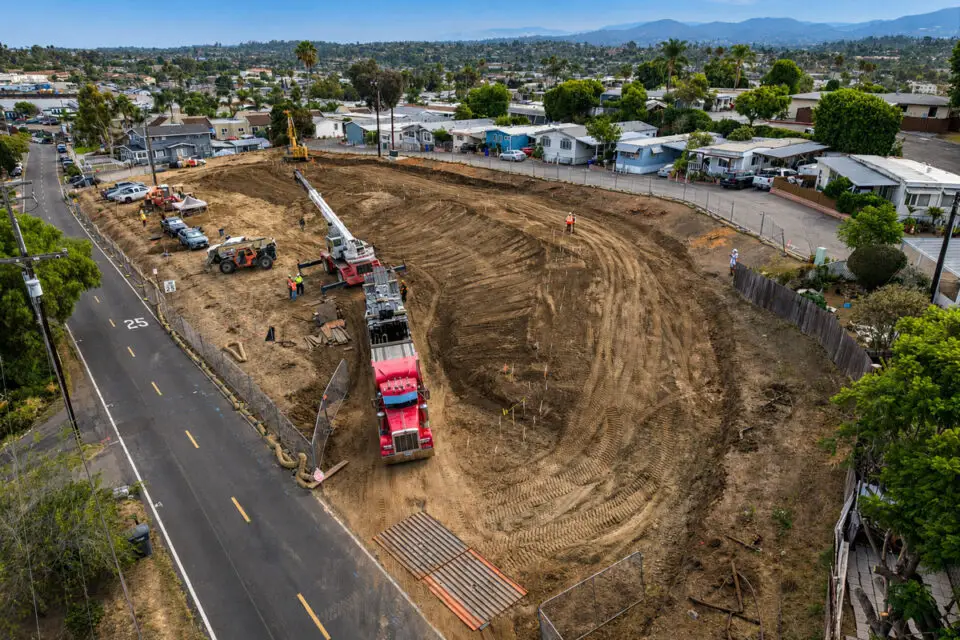 Construction crews and equipment work on the graded site of the future 24-unit Caritas Village – Vista affordable housing development off Plymouth Drive in Vista. Courtesy photo/Level 3 Construction