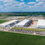 An aerial view shows construction of a large artificial intelligence data center campus with a planned capacity of 600 megawatts in Hutto, Texas. Photo by Steve Heap
