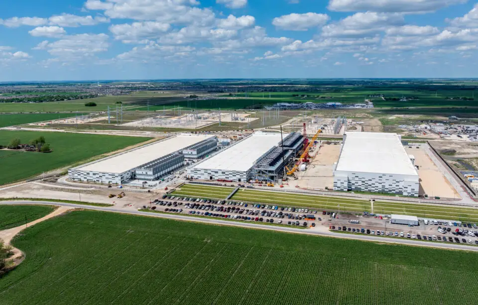 An aerial view shows construction of a large artificial intelligence data center campus with a planned capacity of 600 megawatts in Hutto, Texas. Photo by Steve Heap
