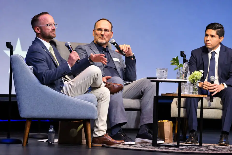 Escondido Mayor Dane White, left, and challenger Elias Velazquez discuss homelessness policy during a Sept. 1 candidate forum moderated by Donnie Dee, center, president and CEO of the San Diego Rescue Mission. Photo by Samantha Nelson