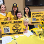 Fallbrook residents hold signs opposing SDG&E’s proposed Golden Pacific Powerlink during a California Public Utilities Commission hearing Sept. 17 at the San Marcos Civic Center. Photo by Jim Trageser