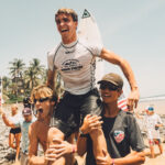 Jett Maughan celebrates his world junior surfing title in El Salvador. The 17-year-old Encinitas surfer helped the United States earn silver in the team competition. Photo courtesy of ISA Surfing Photo Team